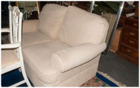 Two Beige Two Seater Upholstered Settees, 56'' in width, 35'' in depth, 85'' in height.