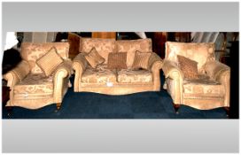 Modern Lounge Suite comprising two seater sofa and two single chairs. Upholstered in beige fabric