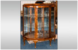 1940's Walnut Display Cabinet with a Shaped Bowed Front on Queen Anne Feet. Squired Decoration to