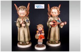 Goebel Hummel Figures, 2 in total. Angels playing musical instruments with little birds watching.