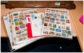 Collection of All World Stamps on loose leaves. Together with loose stamps, card, packs etc. Along