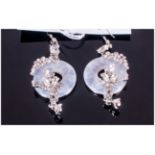 White Quartzite and Crystal Long Drop Earrings, each comprising an open circle of white quartzite