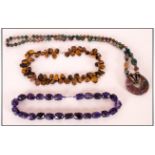 Three Various Gemstone Necklaces Comprising faceted amethyst, long Indian agate with 'doughnut'