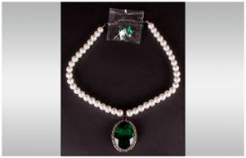 Emerald Green Crystal and White Glass Pearl Necklace and Earrings Set, a large emerald green oval