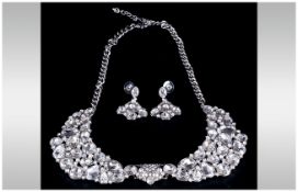 White Crystal Collar Style Necklace and Earrings Set, the necklace comprising two crescent shaped