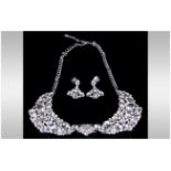 White Crystal Collar Style Necklace and Earrings Set, the necklace comprising two crescent shaped