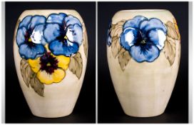 Moorcroft Ovoid Pansy Pattern Vase, two tubelined blue pansies and one yellow to the front, linked