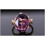 Amethyst Solitaire Ring, an oval cut held in a double prong setting in 9ct gold