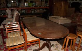 Large Oval Shaped Dark Wood Dining Table.