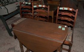Dark Wood Drop Leaf Table with 4 Chairs.