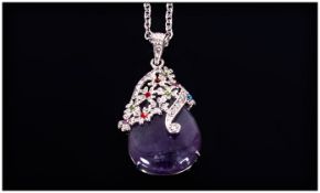 Amethyst Pear Drop Pendant, a pear cut amethyst cabochon held in a fancy floral mount, accented with