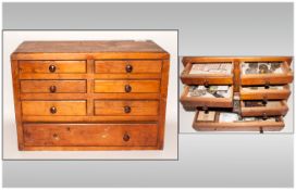 Miniature Pine Chest of Drawers housing a collection of Clock makers tools and spare parts,