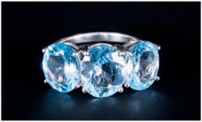 Sky Blue Topaz Three Stone Ring, the central oval cut topaz being 4.5cts, with the similar stones to