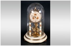 300 Day Brass & Decorated Ball Suspension Clock under glass dome. Made in Germany.