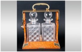 Betjemann Victorian Oak and Brass Tantalus, Contains Two Cut Glass Decanters and Stands 12.5