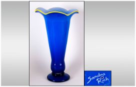 Modern Glass Vase, Royal Blue with yellow wavy rim to top. Signed Sandra Rich. 15 inches in height.