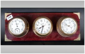 Wall Mounted Barometer/Clock/Hygro in brass bodies, fited to a wooden plaque by Jerger, Quartz,