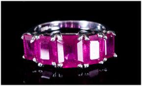 Ruby Five Stone Ring, 6.85cts of octagon cut, graduated rubies of good colour, set in a continuous