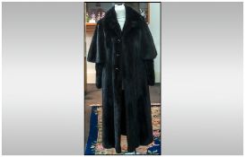 Dark Chocolate Brown Full Length Luxurious Mink Coat, glossy and supple, with an unusual sleeve