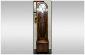 1930's Art Deco Longcase Clock, silvered dial with Arabic numerals, glazed front, triple chrome