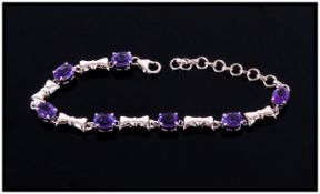 Amethyst Ovals and Bows Bracelet, 8.5cts of oval cut amethysts interspaced with platinum vermeil and
