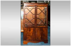 Mahogany Aster glazed Double Door Bookcase, with Cupboards below with Feathered Doors. Terminating