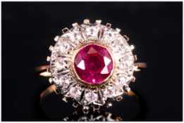 Ladies 9ct Gold Ruby and Diamond Cluster Ring. The Circular Shaped Ruby Surrounded by 12 Small