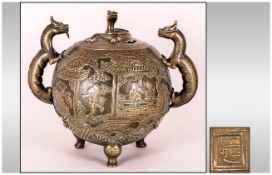 Late 19thC Chinese Bronze Cast Koro of globular form with dragon handles and a pierced lid