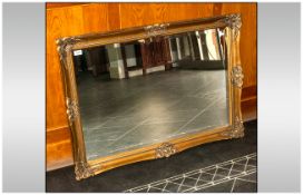 Over Mantle Large Mirror - With gilt frame and bevelled glass. approx 41x30 inches in size.