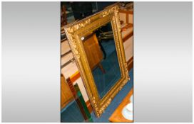 Contemporary Large Gilt Frame Mirror in the Victorian style with bevelled glass. 37 by 50 inches.