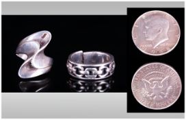Two Silver Dress Rings Together With A 1968 Half Dollar.