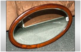 Oval Mirror With Wood Surround And String Inlay - Approx 26x16 inches. Bevelled glass.