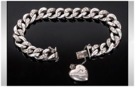 Antique Silver Curb Bracelet with Heart Shaped Small Locket Attached. 8 Inches In Length.