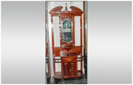 Victorian Style Mahogany Hall stand, with a Shaped Central Mirror, Flanked by Coat Hooks below a