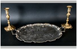Metal Two Handled Tray. Together with a pair of brass candlesticks, 10 inches in height.