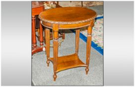 Mahogany Small Oval Shaped Top Centre Table with a carved edge, with a central draw to the side,