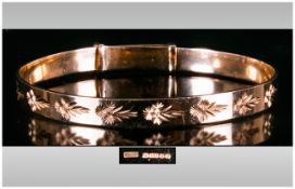 A 9ct Gold Bangle With Engraved Floral Decoration. Fully Hallmarked, London 1996. 15 grams. As New