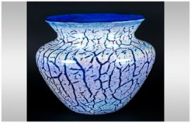 Blue Glass Iridescent Vase, white marbled decoration, 7 inches in height and diameter 9.5 inches.