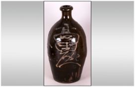 Japanese Late 19th Century Salt Glazed Stoneware Sake Bottle of Tapered Ovoid Form, with cylindrical