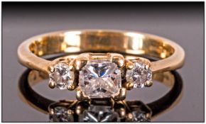 18ct Gold Diamond Ring Set With A Central Square Cut Diamond Between Two Round Brilliant Cut