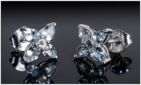 Pair of Aquamarine Stud Earrings, each comprising four pear cut aquamarines in a star or flower