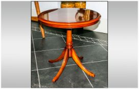 Reproduction Mahogany Wine Table with an inlaid circular top supported on a colour centre,