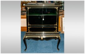 Black Lacquered Revolving Cabinet on shaped cabriole leg stand, decorated in gilt work, the two