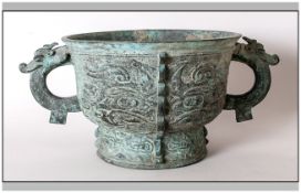 Chinese Bronze Incense Bowl in the archaic style, with green verdi colouration, cast with dragon