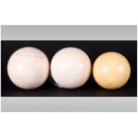 A Set of Three Late Victorian/Early Edwardian Ivory Billiard/Snooker Balls. Weighing 148.9 g 140.4 g