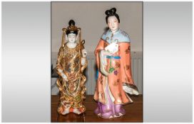 Two Oriental Figures, 1. Satsuma Buddha Figures, 2. Japanese Lady In A Formal Ground.