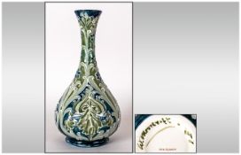 W. Moorcroft Signed Florian Ware Vase. Reg Num.326689. Iris Design on Blue and Green Ground.