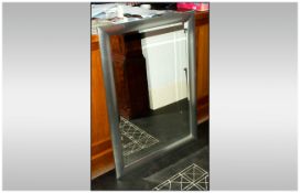 Contemporary Silver Framed Mirror, bevelled glass, measures 41 by 28 inches.