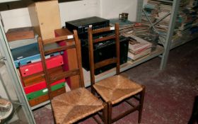 Two Wooden Chairs with Wicker Seats.