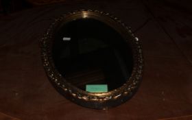 Oval Framed Mirror.